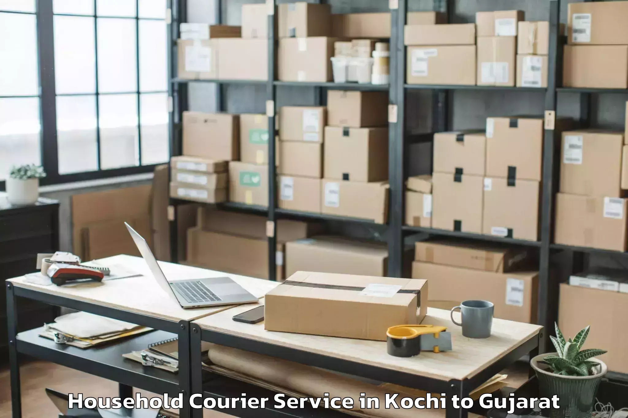 Professional Kochi to Navsari Agricultural Universit Household Courier